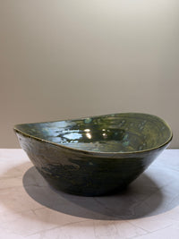 Oval åkande skål